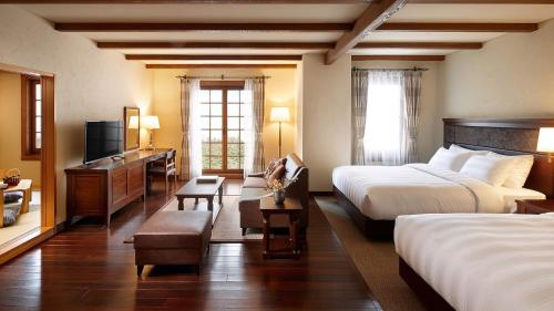 Postel nebo postele na pokoji v ubytování Lotte Arai Resort