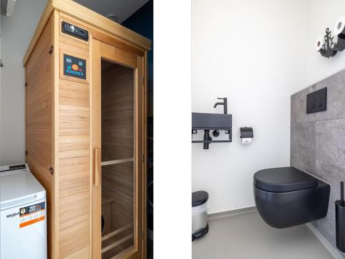 a bathroom with a toilet and a sink at Apartment in Sint-Annaland near Marina in Sint Annaland