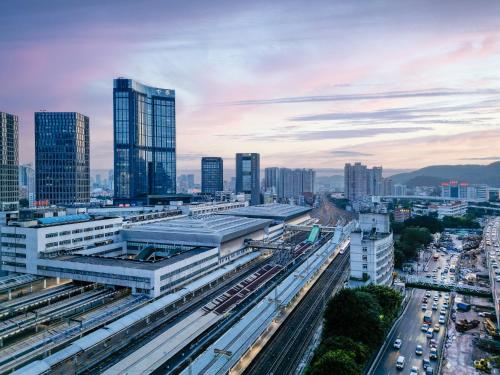 a city with a train station and buildings at Yueta E-Sports Hotel-10min to Guangzhou East Railway Station&Entrance Exit J of Line 3 in Guangzhou