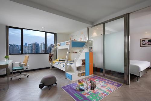 a kids room with a bunk bed and a desk at Holiday Inn Shanghai Vista by IHG - Easy access to travel spot city walk in Shanghai