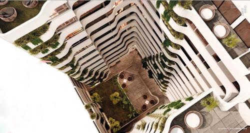 eine Aussicht auf ein Hochhaus mit Pflanzen in der Unterkunft Alojamiento Mama Ocllo in Lima