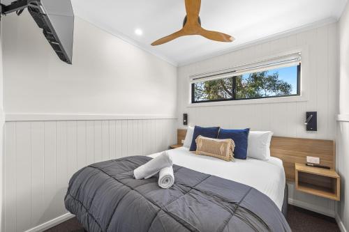 a bedroom with a bed and a ceiling fan at BIG4 Ingenia Holidays Inverloch in Inverloch