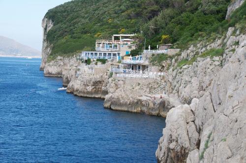 a group of buildings on the side of a cliff at Villa Eva in Anacapri