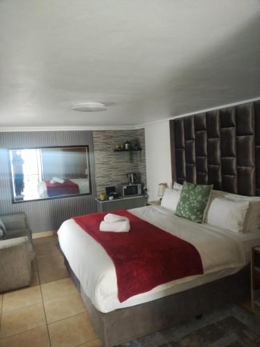 Ένα ή περισσότερα κρεβάτια σε δωμάτιο στο Buckleigh Guesthouse