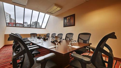 a conference room with a long table and chairs at University Place Hotel and Conference Center in Portland