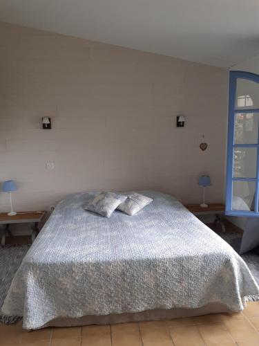 Postel nebo postele na pokoji v ubytování La Bleuette