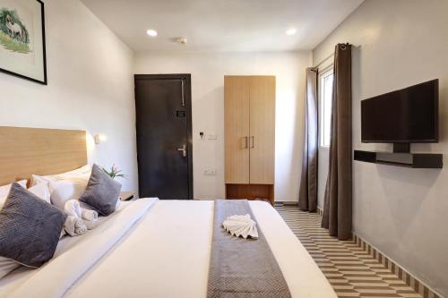 Hotel The Rasa Near Welcome Metro Stationにあるベッド