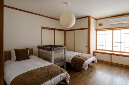Cama o camas de una habitación en 洞爺 Private Inn Kazu