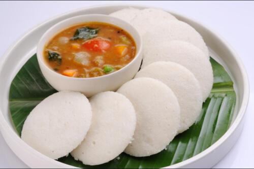 a plate of food with a bowl of soup at Green Tea Hotels in Devikolam