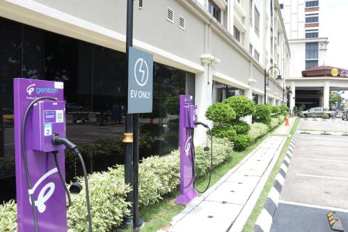 a row of purple electric meters next to a building at Perdana Kota Bharu in Kota Bharu
