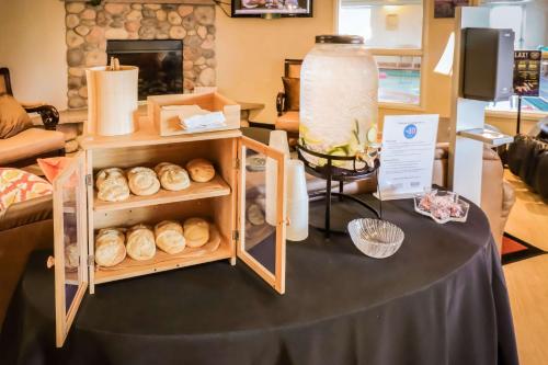 a table with a bunch of donuts on it at Quality Inn & Suites Sequim at Olympic National Park in Sequim