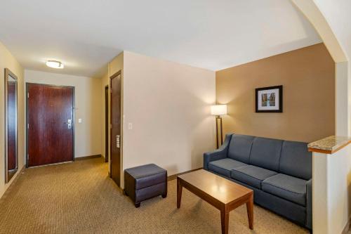 a living room with a couch and a table at Comfort Inn & Suites Gillette near Campbell Medical Center in Gillette