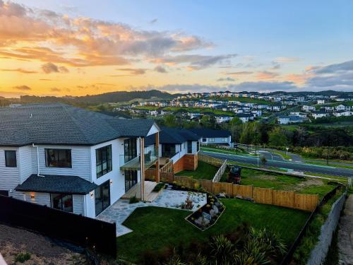 a house with a view of a city at Orewa New house with view on deck near Cafe,bush & river in Orewa