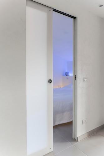 Ένα ή περισσότερα κρεβάτια σε δωμάτιο στο Bianco Nuvola