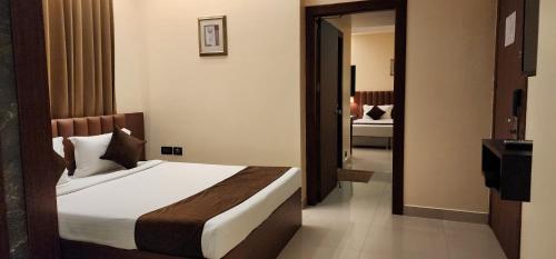 Una cama o camas en una habitación de Hotel Arcadia