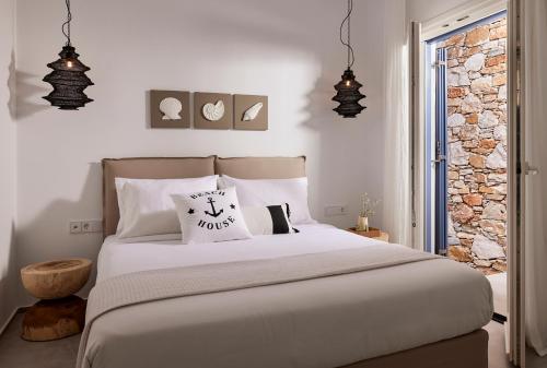 Ένα ή περισσότερα κρεβάτια σε δωμάτιο στο Eutopia Suites Sifnos