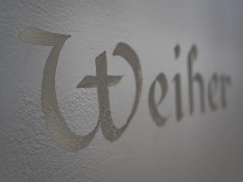 a painting of a cross on a wall at Niedermairhof in Brunico