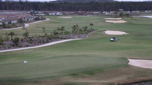 an aerial view of a golf course at Lovely Studio Apartment Overlooking Golf Course! in Pelican Waters