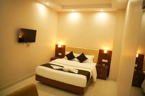Hotel Mystic Mithilaにあるベッド