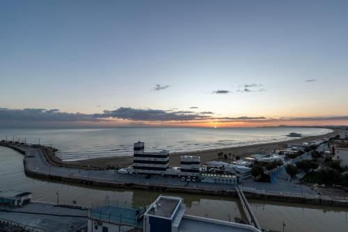 an aerial view of a beach at sunset at Visionair Suites & SPA-Room Only e Honesty Bar in Senigallia