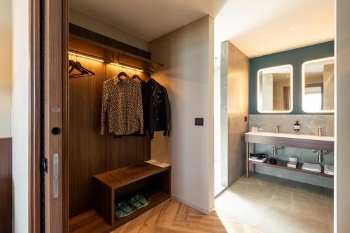 a bathroom with a sink and a mirror at Visionair Suites & SPA-Room Only e Honesty Bar in Senigallia