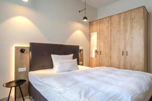 Postel nebo postele na pokoji v ubytování Hotel Esplanade Dortmund