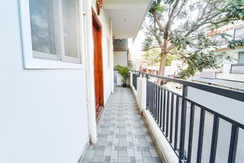 a hallway of a house with a balcony at SS Suites in Bengaluru