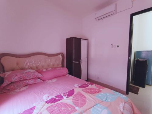 Кровать или кровати в номере Sweet House Homestay Near Mall Pekanbaru Sudirman