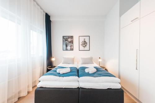 Ένα ή περισσότερα κρεβάτια σε δωμάτιο στο Forenom Aparthotel Helsinki Pikku Huopalahti