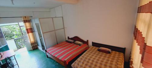 Postel nebo postele na pokoji v ubytování 38 guest house