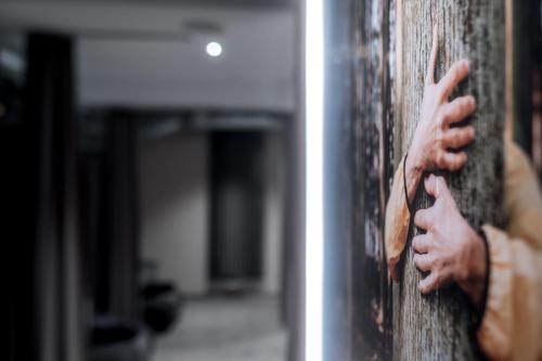 a person opening a door with their hands on it at Hotel Esplanade Dortmund in Dortmund