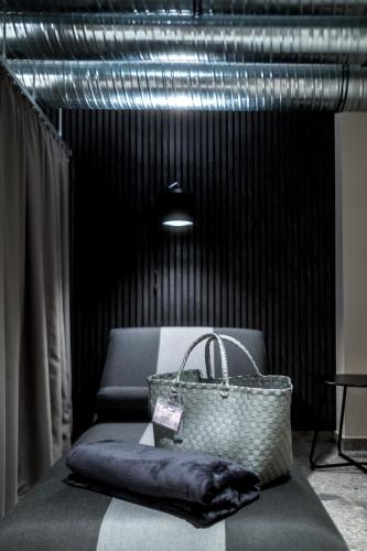 a purse sitting on top of a bench in a room at Hotel Esplanade Dortmund in Dortmund