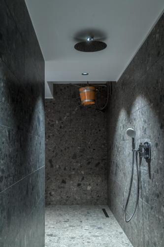 a bathroom with a shower with a shower head at Hotel Esplanade Dortmund in Dortmund