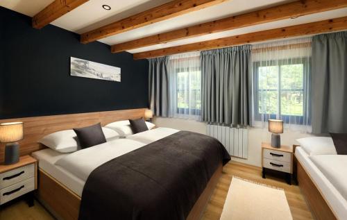 Postel nebo postele na pokoji v ubytování Holiday Village Tatralandia
