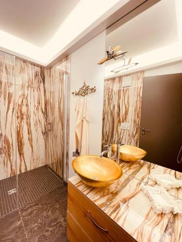 a bathroom with two wooden sinks on a counter at Penthouse Traum - Blick über Arnstadt in Arnstadt