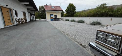a driveway leading to a house with a building at AppPrusnik in Ljubljana