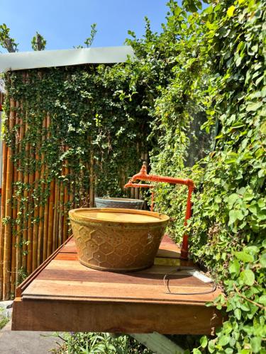 a water fountain sitting on top of a wooden deck at JoyStay in Cat Ba