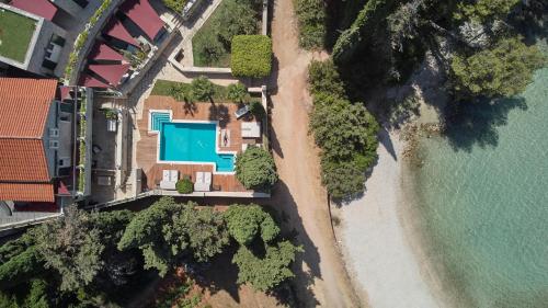 an aerial view of a house next to the water at Villa Diocletian's Palace in Supetar