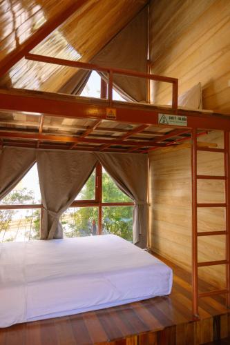 a bedroom with a bunk bed in a house at JoyStay in Cat Ba