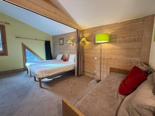 Postel nebo postele na pokoji v ubytování Résidence Christiana 603 Clés Blanches Courchevel