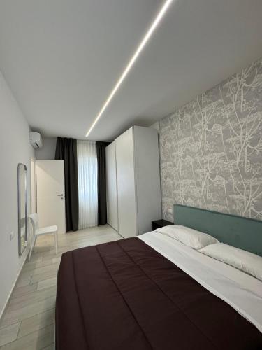 a bedroom with a large bed in a room at Residence Cervia in Cervia