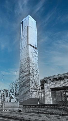 a tall glass tower in front of a building at Ferienwohnung Forstblick in Kranenburg