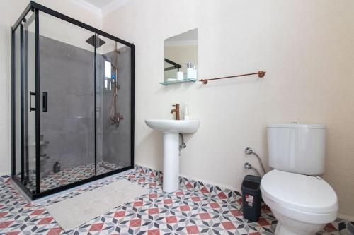 a bathroom with a shower and a toilet and a sink at Soft and Historic 3BR Home w Iconic Haydarpasa View in Istanbul