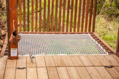 a metal grate on a wooden deck at Heritage Ecolodge in Le Tampon