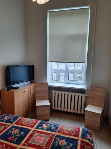 Postel nebo postele na pokoji v ubytování Spacy apartment in Kaunas center