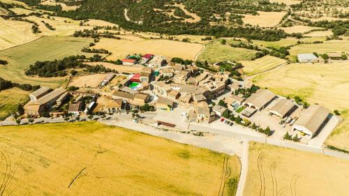 an aerial view of a small town in a field at Cal Comorera in Masoteras