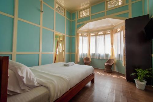 Ένα ή περισσότερα κρεβάτια σε δωμάτιο στο OOtO Homestay