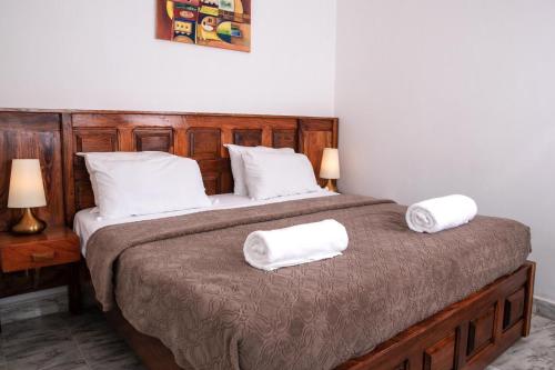 Cama o camas de una habitación en Seaview Gardens Hotel
