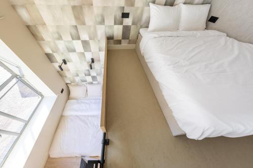Ένα ή περισσότερα κρεβάτια σε δωμάτιο στο StayIn - Ede