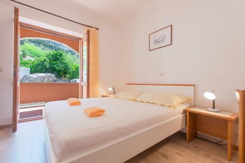 Posteľ alebo postele v izbe v ubytovaní Apartments Ruze